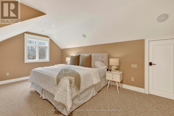 Bedroom with pitched ceiling, tufted headboard, and window - 160 Sunset Boulevard Blue Mountains