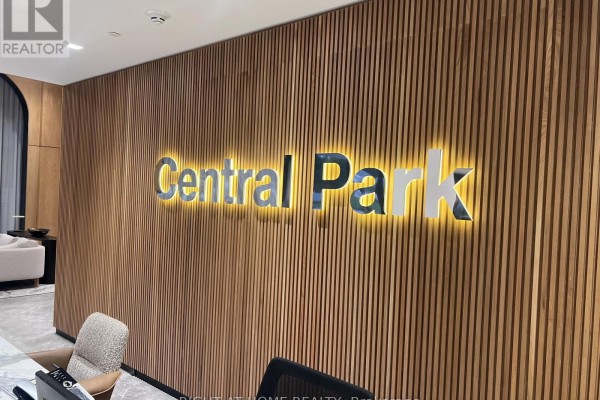Close-up of the illuminated "Central Park" sign on a slatted wood wall. - 1607 - 29 Green Trail Court, Toronto