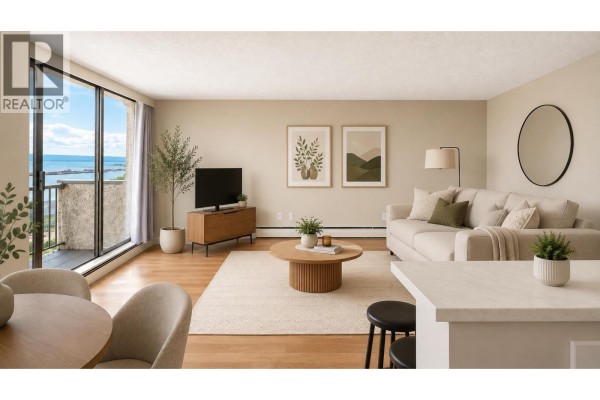 Living room with large windows, beige walls, light wood floors, and a distant water view. - 1607 145 St. Georges Avenue, North Vancouver