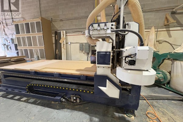 Large CNC router with blue and white accents on a wooden platform. - 161 Alden Road N, Markham