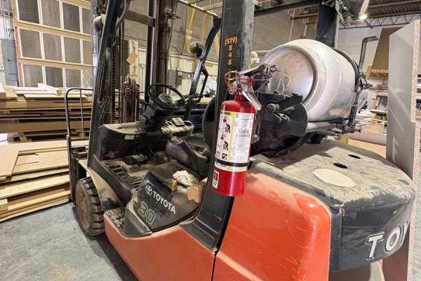 Orange Toyota forklift with a red fire extinguisher mounted on its side. - 161 Alden Road N, Markham