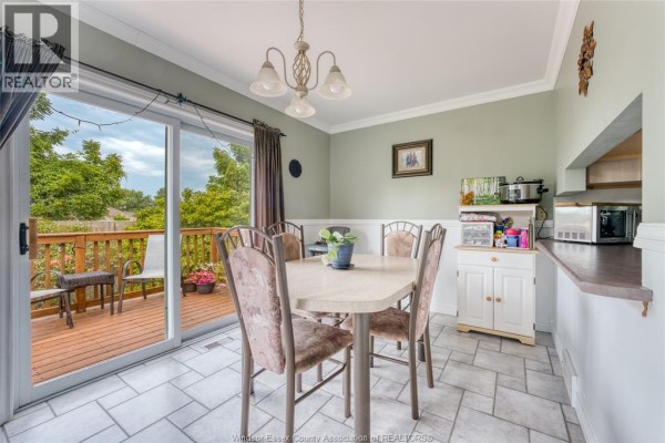 Dining room with table, chairs, deck access, and tile floor - 1610 Chornoby Crescent Tecumseh