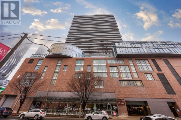 Exterior view of a modern building with brick and glass facade. - 1612 - 1 Market Street, Toronto