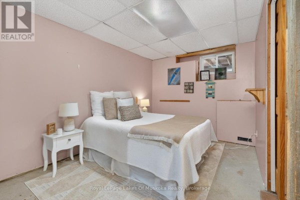 Bedroom with a bed and nightstand - 1616 Skyline Drive Huntsville