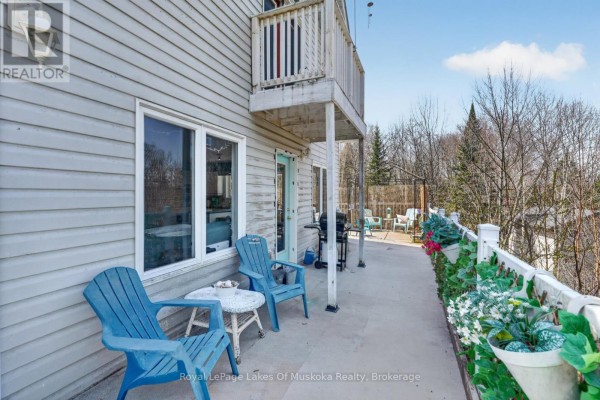 Deck with chairs and grill overlooking wooded area - 1616 Skyline Drive Huntsville