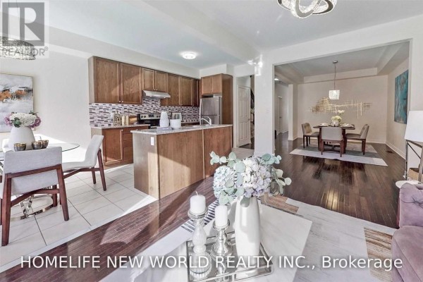 Open concept kitchen with dark wood cabinets and adjacent dining room. - 162 Noah's Farm Trail, Whitchurch Stouffville