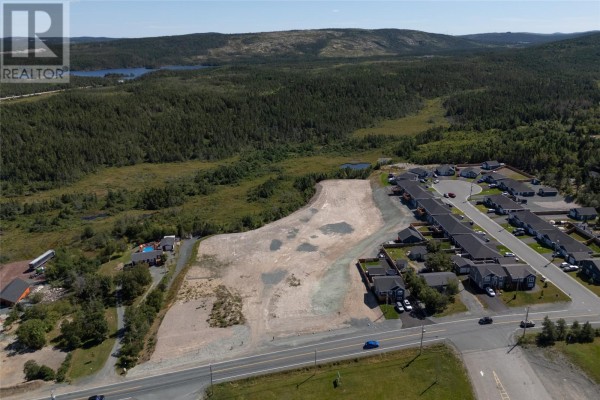 Aerial shot of vacant land with surrounding houses and natural landscape. - 1621-1631 Conception Bay Highway, Conception Bay South