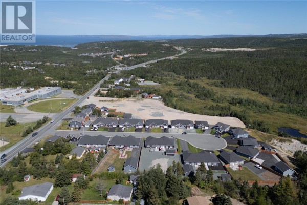Panoramic aerial view of land for sale near residential properties and coastline. - 1621-1631 Conception Bay Highway, Conception Bay South
