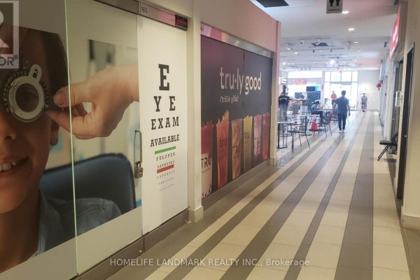 Indoor commercial hallway with storefronts, seating areas, and linoleum floors. - 163 - 4750 Yonge Street, Toronto