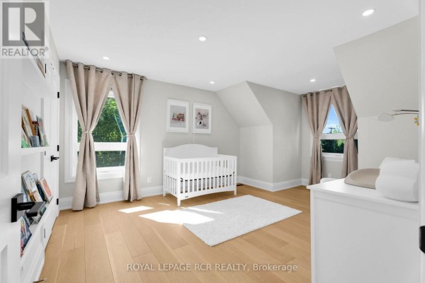 Nursery with crib and bookshelf - 163 Confederation Street Halton Hills