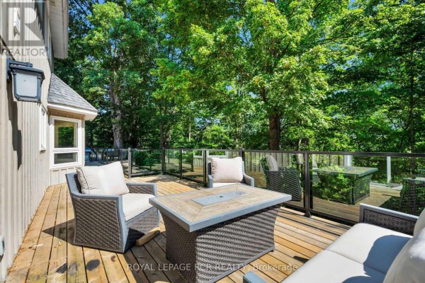 Deck with wicker furniture and fire pit table - 163 Confederation Street Halton Hills