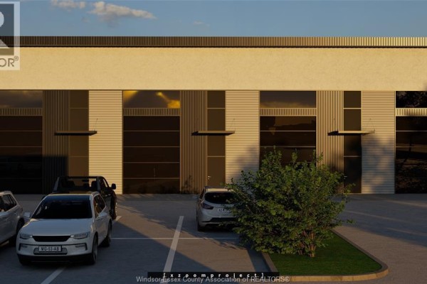 Modern office space with rows of desks, cubicles, and large windows. - 1636 Howard, Windsor