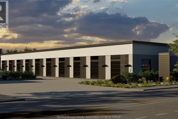 Exterior view of a commercial building with multiple garage bay doors. - 1636 Howard, Windsor