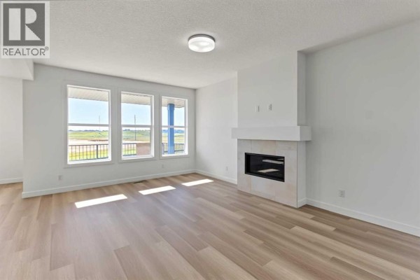 Living room - 164 Copperhead Road Se, Calgary, AB T2Z5H6 Photo 4