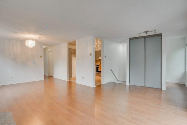 Apartment interior showing hallway, living area, and view into kitchen. - 165 Av. Des Jonquilles, #74, Gatineau