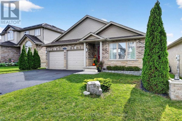 Overhead view of the street, showing the bungalow and neighboring houses with parked cars. - 1653 Cedarcreek Crescent, London North