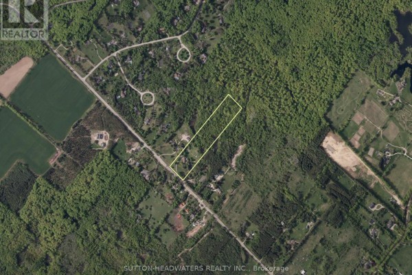 Aerial view of a large wooded property with a long driveway off Mississauga Road. - 16735 Mississauga Road, Caledon