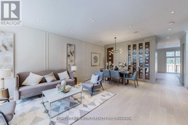 Open concept living and dining room with a sofa, dining table, and wine display cabinets. - 168 Glenvale Boulevard, Toronto