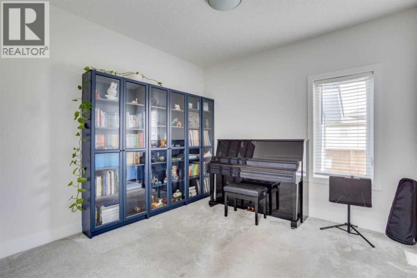 Interior view of a home entrance with double doors, light grey wood-look flooring, and a decorative plant. - 169 Beaveridge Close, Fort Mcmurray
