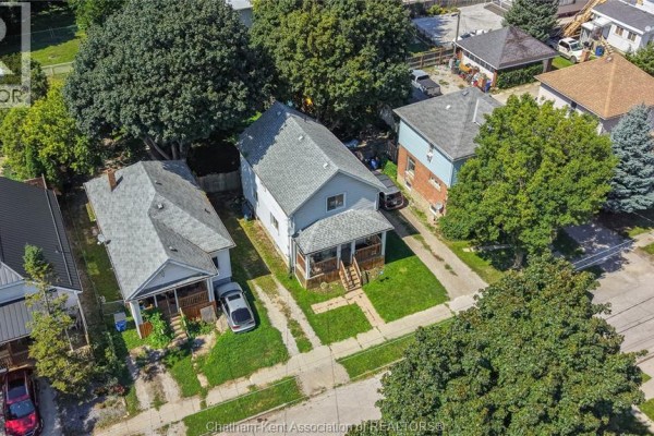 Aerial view of houses and mature trees on a residential street - 169 Lorne Avenue Chatham