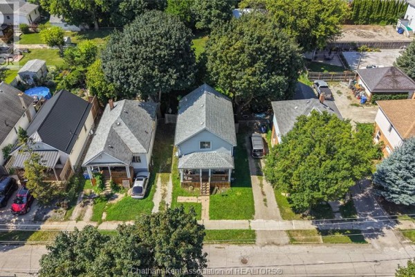 Aerial view of a home with a covered porch and driveway - 169 Lorne Avenue Chatham