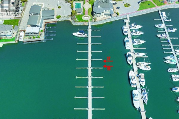 Aerial view of marina highlighting dock number 17, with boats and waterfront buildings nearby. - 17 - 1295 Wharf Street, Pickering