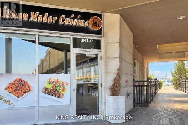 Exterior view of 'Ishan Madar Cuisine' with signage and entrance pathway. - 17 - 3175 Rutherford Road, Vaughan