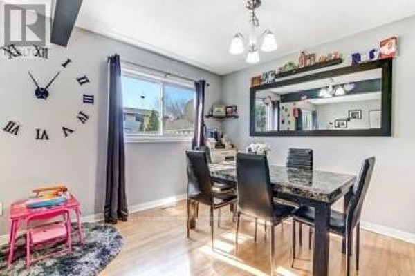 Dining room with marble table, black chairs, and large mirror - 17 - 711 Osgoode Drive London South