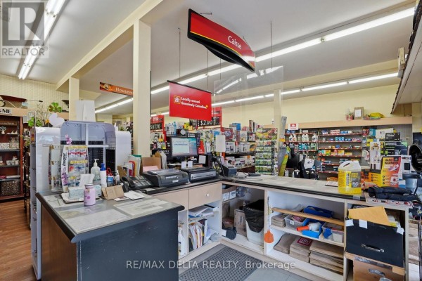 Another interior shot of the store, highlighting the checkout counter and merchandise on shelves. - 17 Main Street E, Champlain