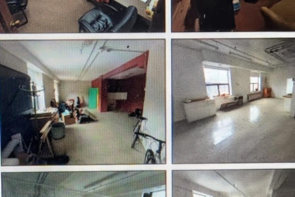 Bright open studio with large windows, light wood floors, and partition walls. - 17 Paton Road, Toronto