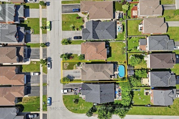 Aerial view of the property at 17 White Crescent, Barrie, highlighting the backyard pool. - 17 White Crescent, Barrie
