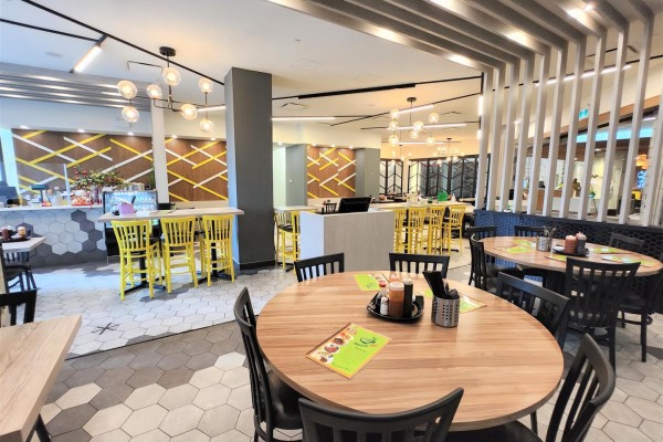 Commercial kitchen with a stainless steel wok stove, burners, and exhaust hood. - 170, 10235 101 Street Nw, Edmonton