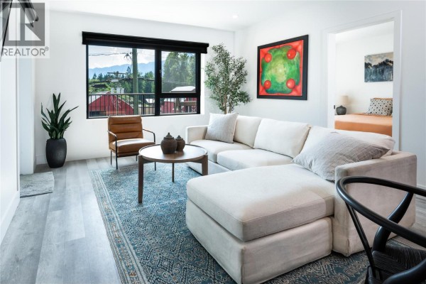 Outdoor hot tub on a private deck with wood flooring and surrounding views. - 1701 Coursier Avenue Unit# 2213, Revelstoke