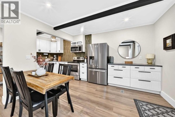 Living room - 1702, 11010 Bonaventure Drive Se, Calgary, AB T2J3A8 Photo 4