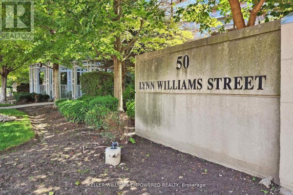 Close-up of the concrete sign that reads "50 Lynn Williams Street". - 1711 - 50 Lynn Williams Street, Toronto