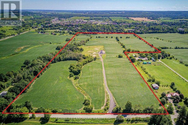 Aerial view of a large parcel of farmland outlined in red. - 17305 10th  Concession, King