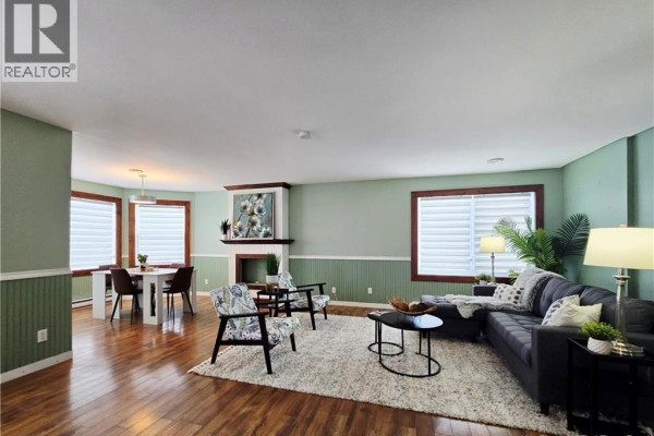 Living room with seating area, fireplace, and large windows - 1737 Route 355, Sainte Rose