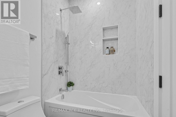 Bathtub with rainfall shower head and built-in niche - 175 Harewood Avenue Toronto