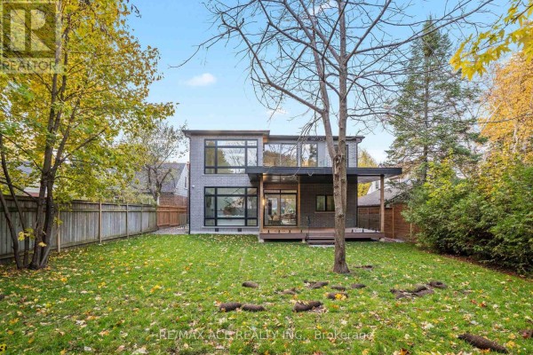 Modern home with large windows and deck - 175 Harewood Avenue Toronto