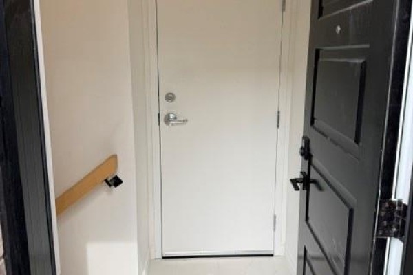 View of a front door opening into a hallway with white walls and a light-colored floor. - 175 Margaret Avenue Unit# Lower, Hamilton