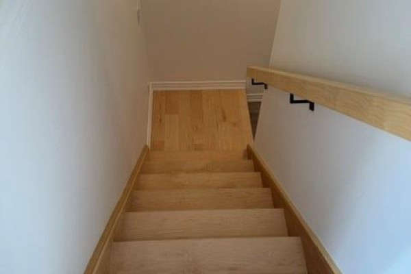 Looking down a wooden staircase with white walls and a light wood handrail in a home interior. - 175 Margaret Avenue Unit# Lower, Hamilton