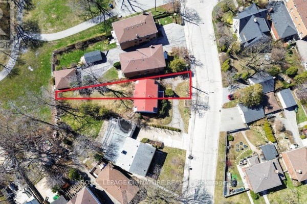 Aerial view showing property boundaries outlined in red with existing houses and garages. - 175b Lake Shore Drive, Toronto