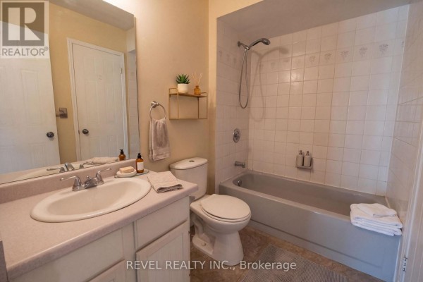 Bathroom vanity, toilet, and tub with shower - 176 Towerhill Road Peterborough