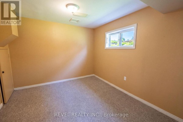 Bedroom with tan walls and carpet - 176 Towerhill Road Peterborough