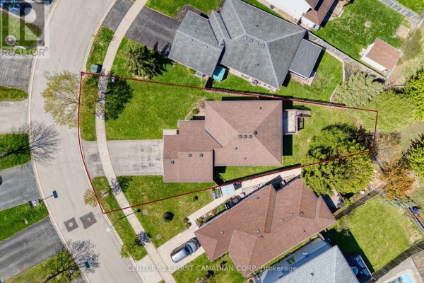 Overhead aerial view of the property at 1761 Devos Drive, showing the house and backyard boundary. - 1761 Devos Drive, London North