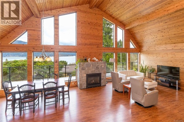 Panoramic view of forested hills and water from the property on a cloudy day. - 1766 Pritchard Rd, Cowichan Bay