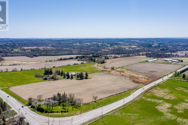 Aerial perspective of a farm property located at a road intersection surrounded by agricultural land. - 1783 Lloydtown-aurora Road, King