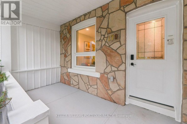 Close-up of the front door and stone exterior of the home. - 179 Oakcrest Avenue, Toronto