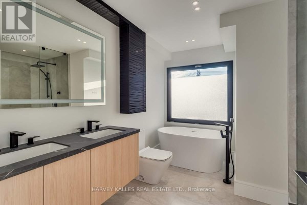 Double vanity, soaking tub, and walk-in shower - 179 Palmerston Avenue Toronto