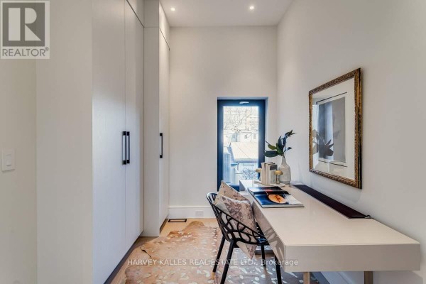 Modern office with desk, built-in closets, and cowhide rug - 179 Palmerston Avenue Toronto